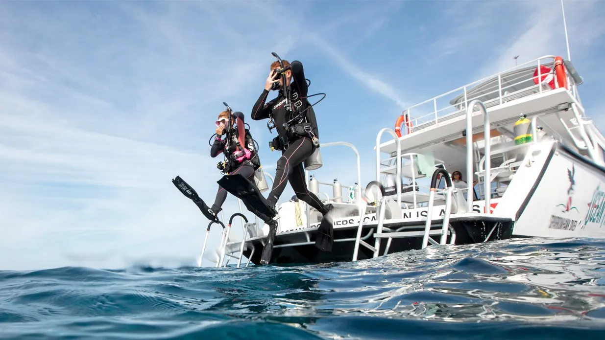PADI Boat Diver - Two Divers Giant Stride Off Boat